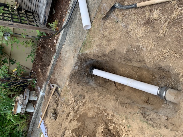 exposed sewer pipe that needs to be unclogged